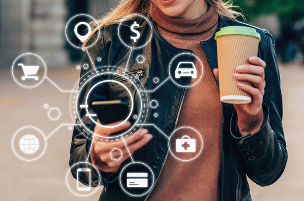 A woman is using her smartphone. Around the phone are some icons that represent shopping, information, contact, address, payment and transportation.
